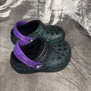 CROCS Kids Glittery Black Clogs with Purple Strap